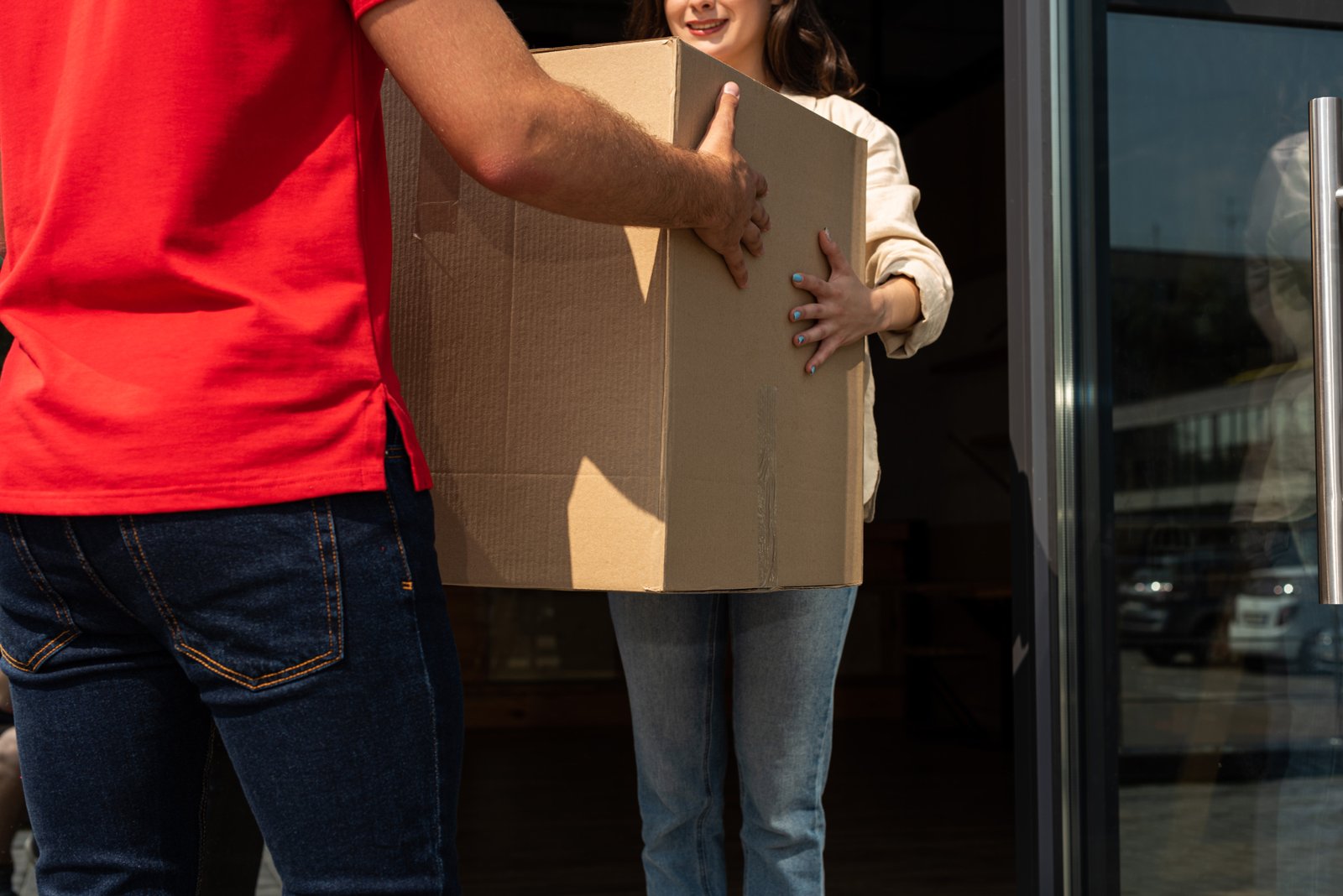 cropped view of delivery man giving carton box to 2023 11 27 05 22 40 utc